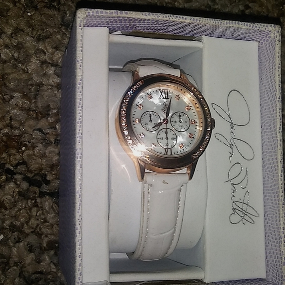 Jaclyn Smith rose gold watch with white leather band